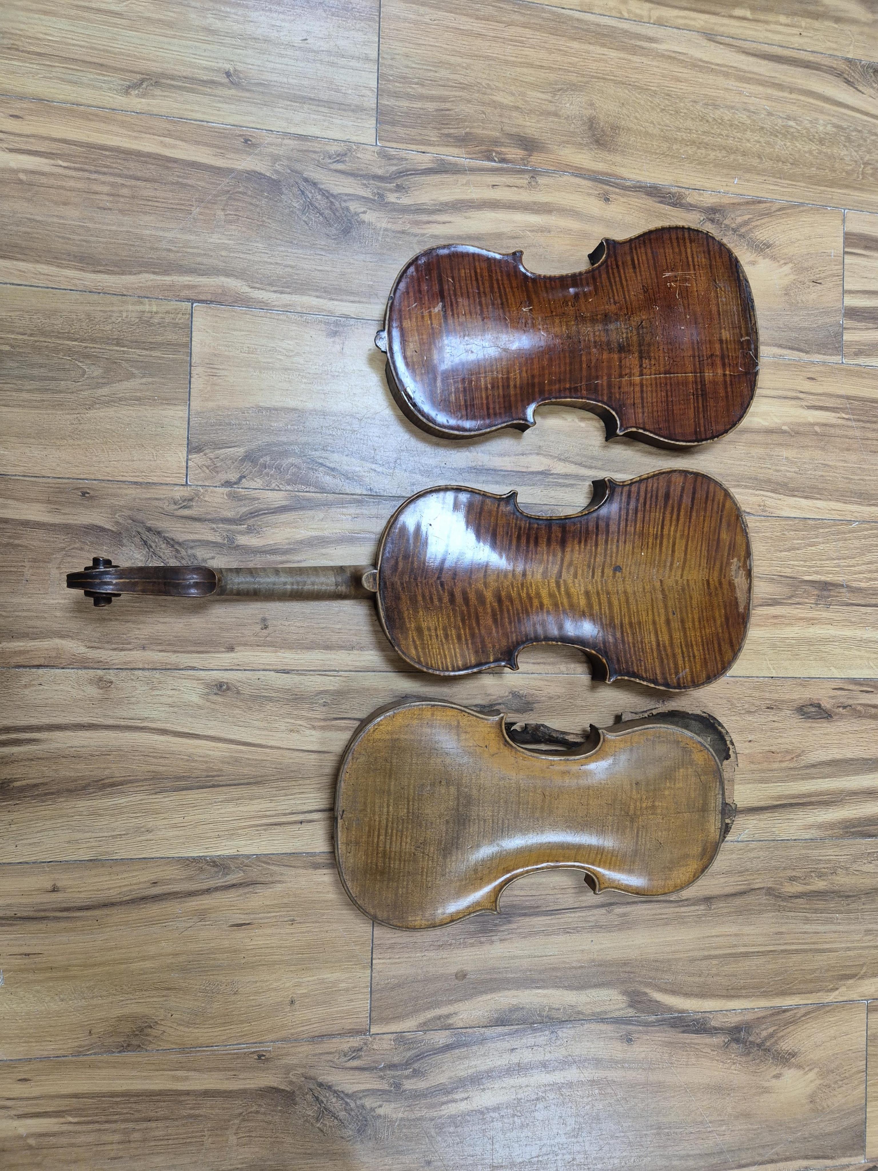 A quantity of violin parts and violins, a ukelele, a double bass scroll, a pinfold metronome, a violin case by Hill, a viola etc. Condition - for restoration